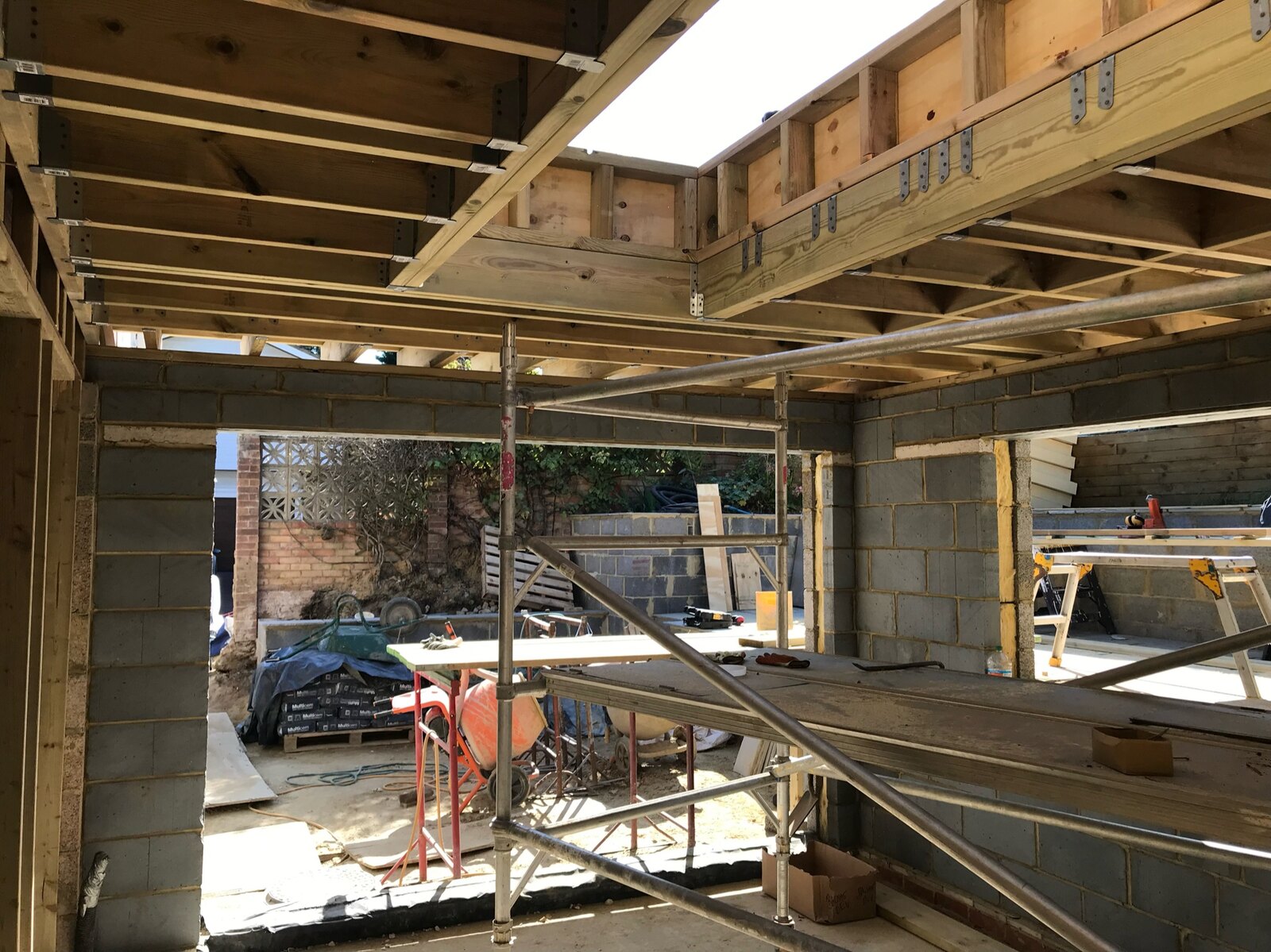 Structural work in progress with steel beams and an opened-up ground floor